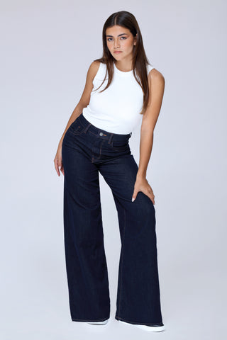 Model wearing Funky Soul skate wide leg jeans with white tee and sneakers