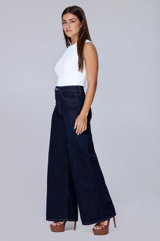 Model styling Funky Soul skate jeans with heels and casual elegance.